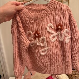 Big Sis hand knitted sweater IG: Little Looks by Lily.